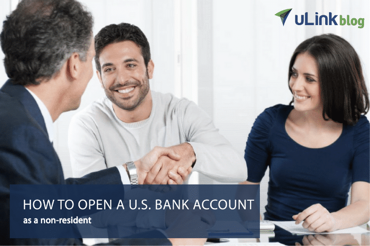 young married couple meeting with a banker to open a u.s. bank account